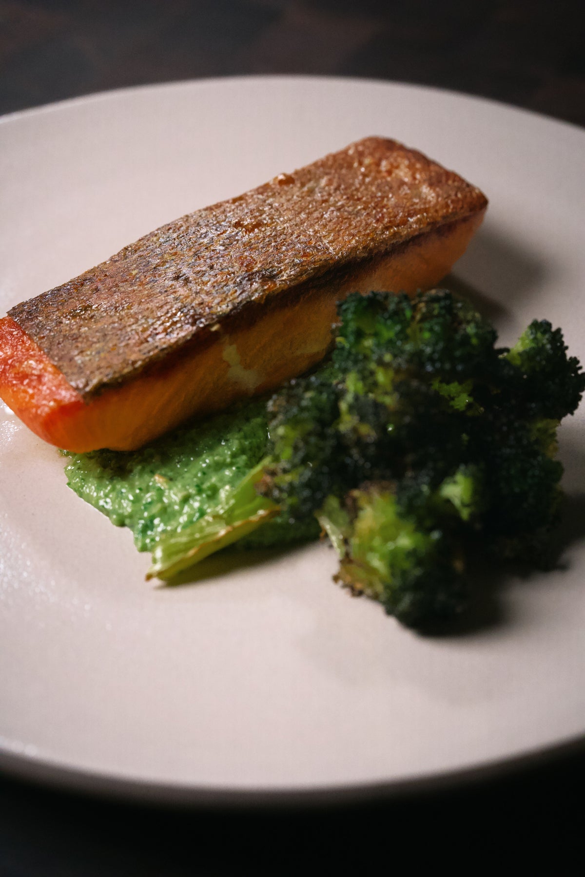Crispy skin King Salmon on snap pea pesto with roasted broccoli