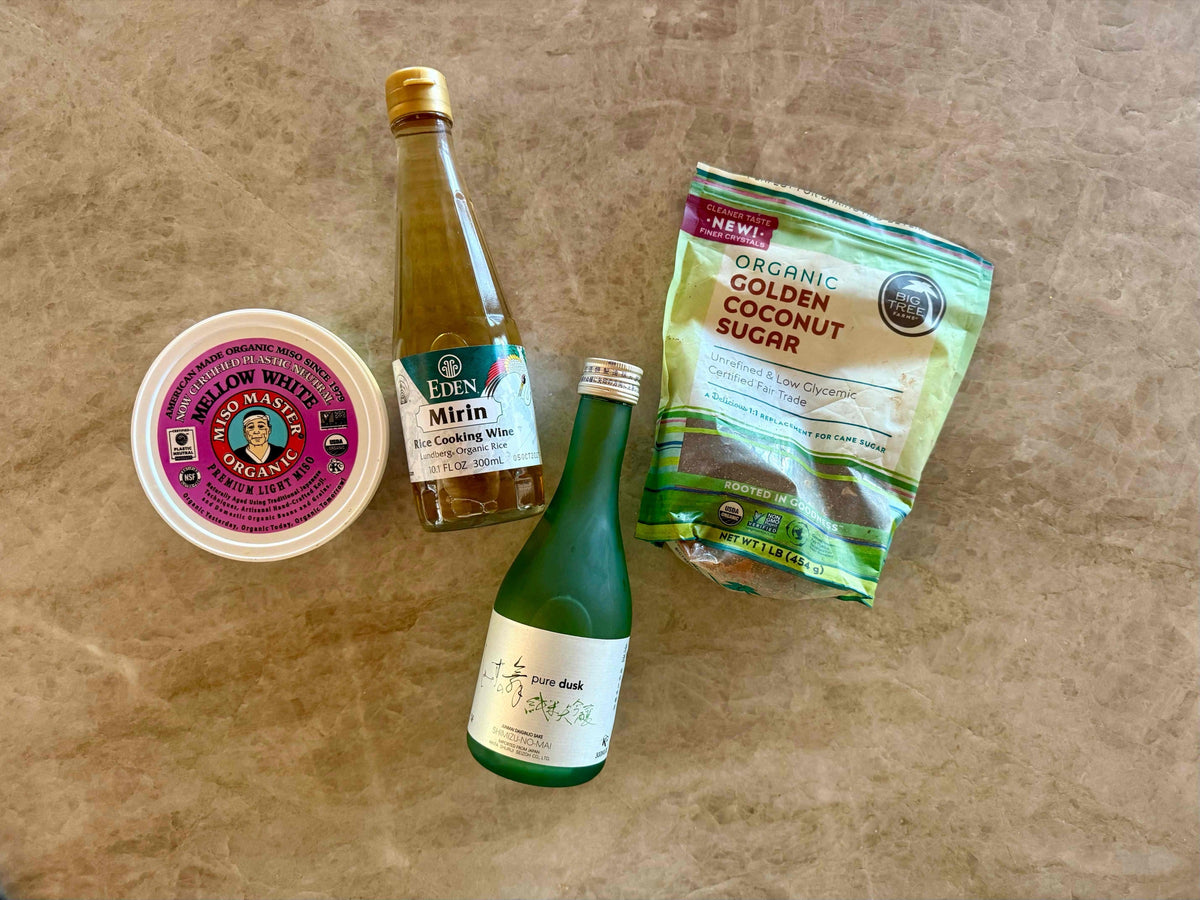Ingredients for miso-glazed king salmon bento: salmon fillets, sake, miso paste, coconut sugar, sushi rice, broccolini, avocado, pickled red onions and salmon roe